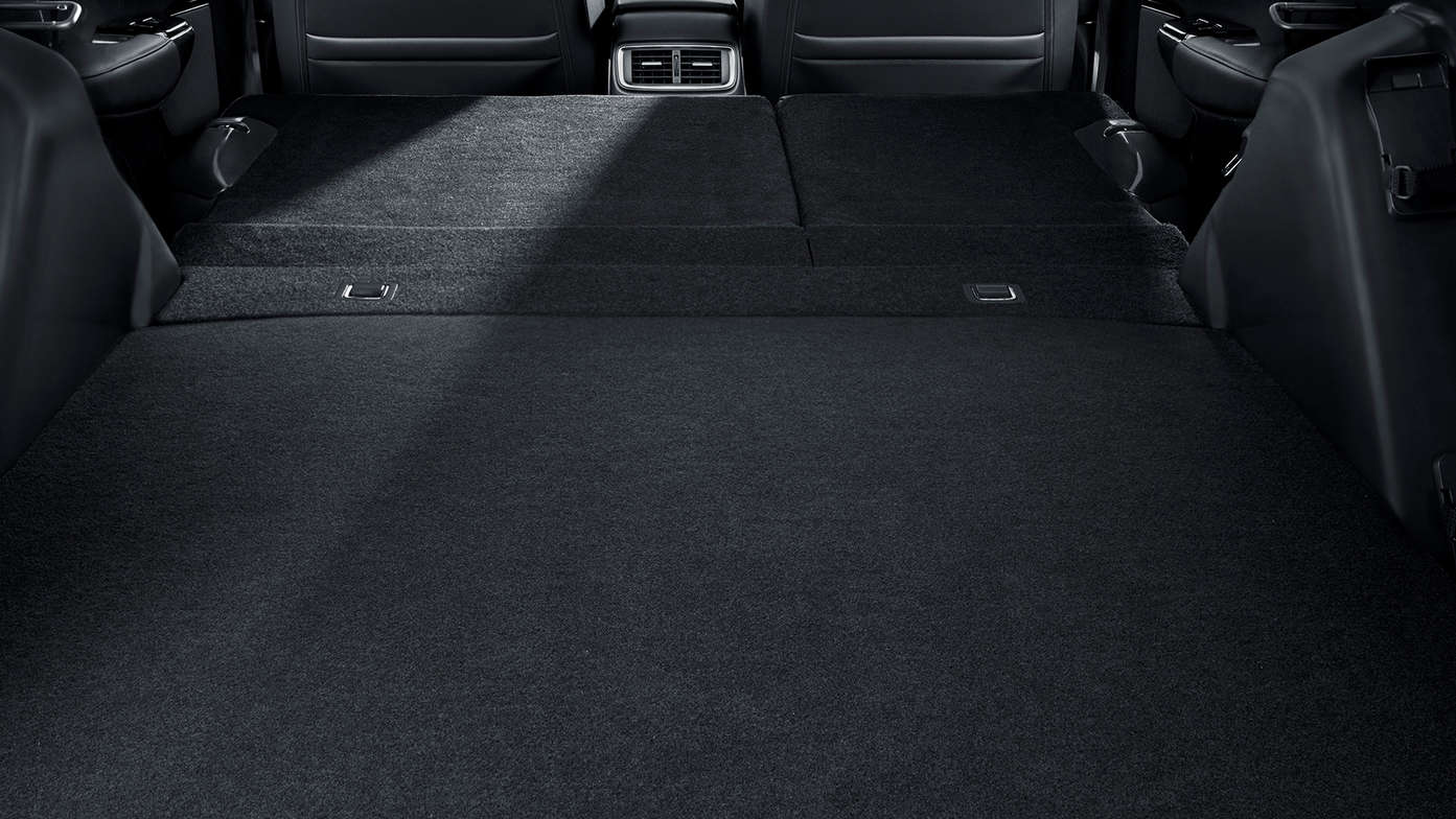 Vue de l'habitacle du Honda CR-V Hybrid illustrant la fonction sièges rabattables.