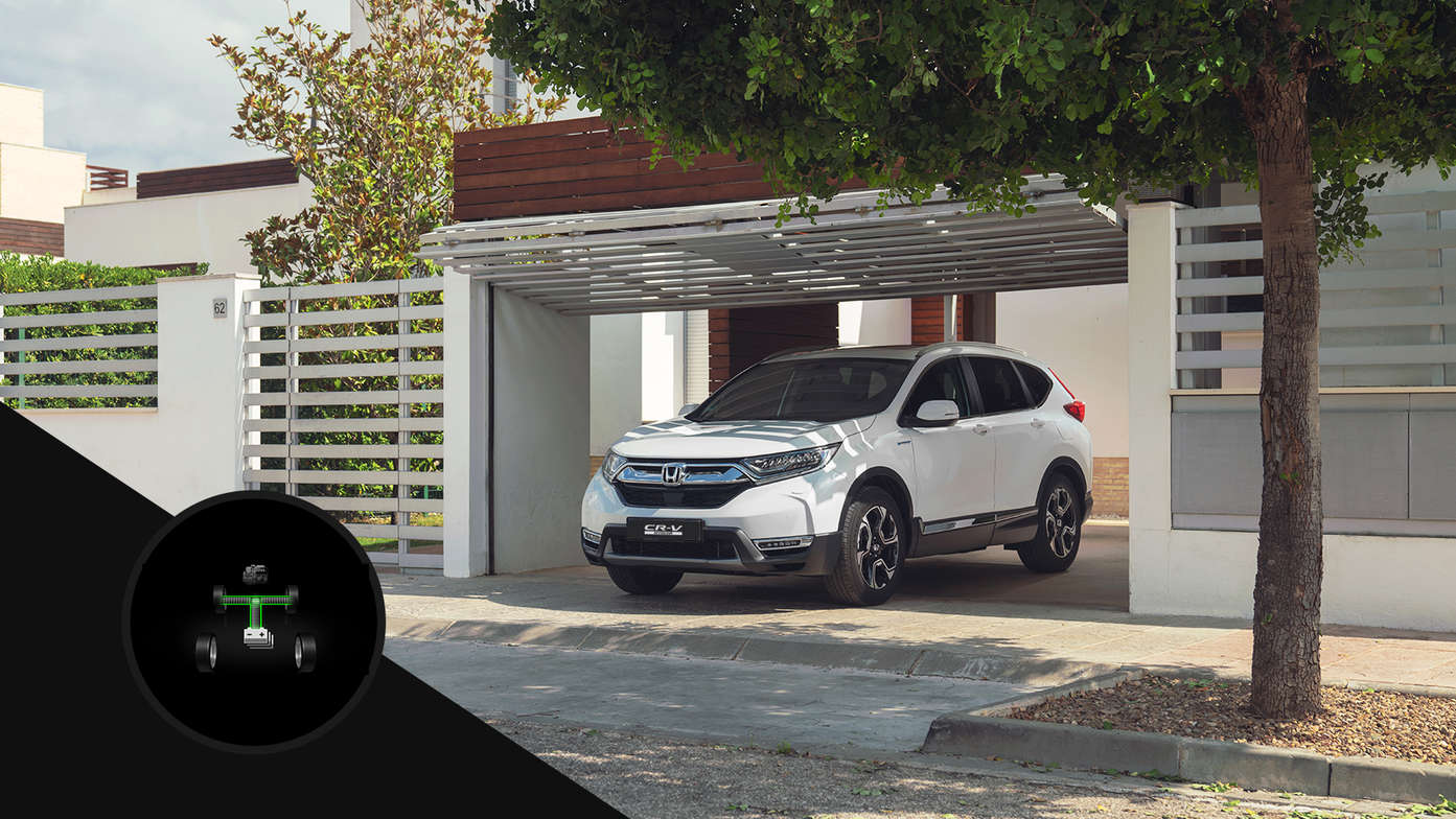 Vue latérale du Honda CR-V Hybrid stationné dans un garage pour illustrer le mode électrique.
