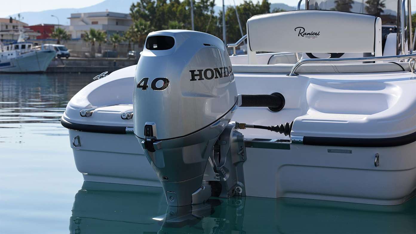 A moored luxury speed boat with a Honda BF 40 outboard engine