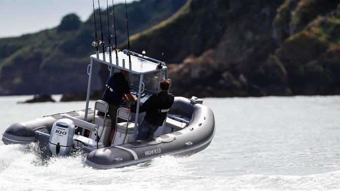 Boat with BF80 engine, being used by models, coastal location.