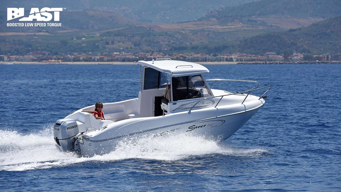 Speed boat powering along a lake