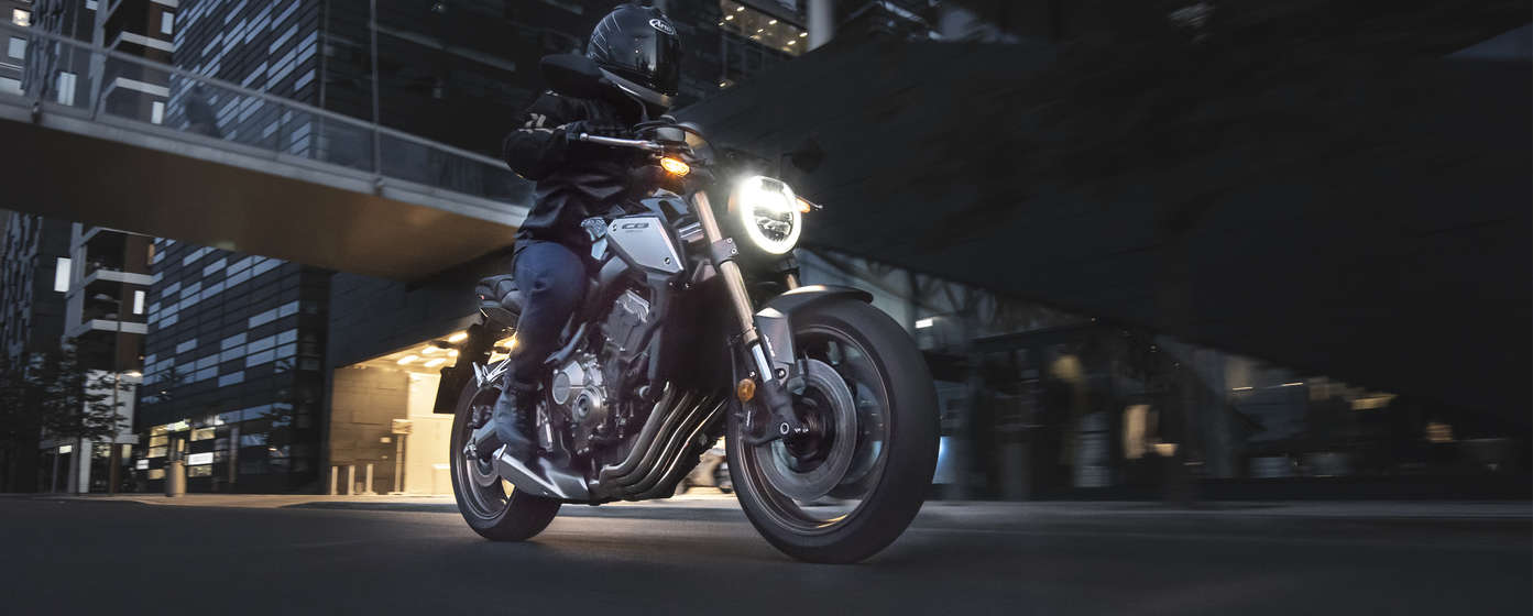 Honda CB650R being ridden in street location.